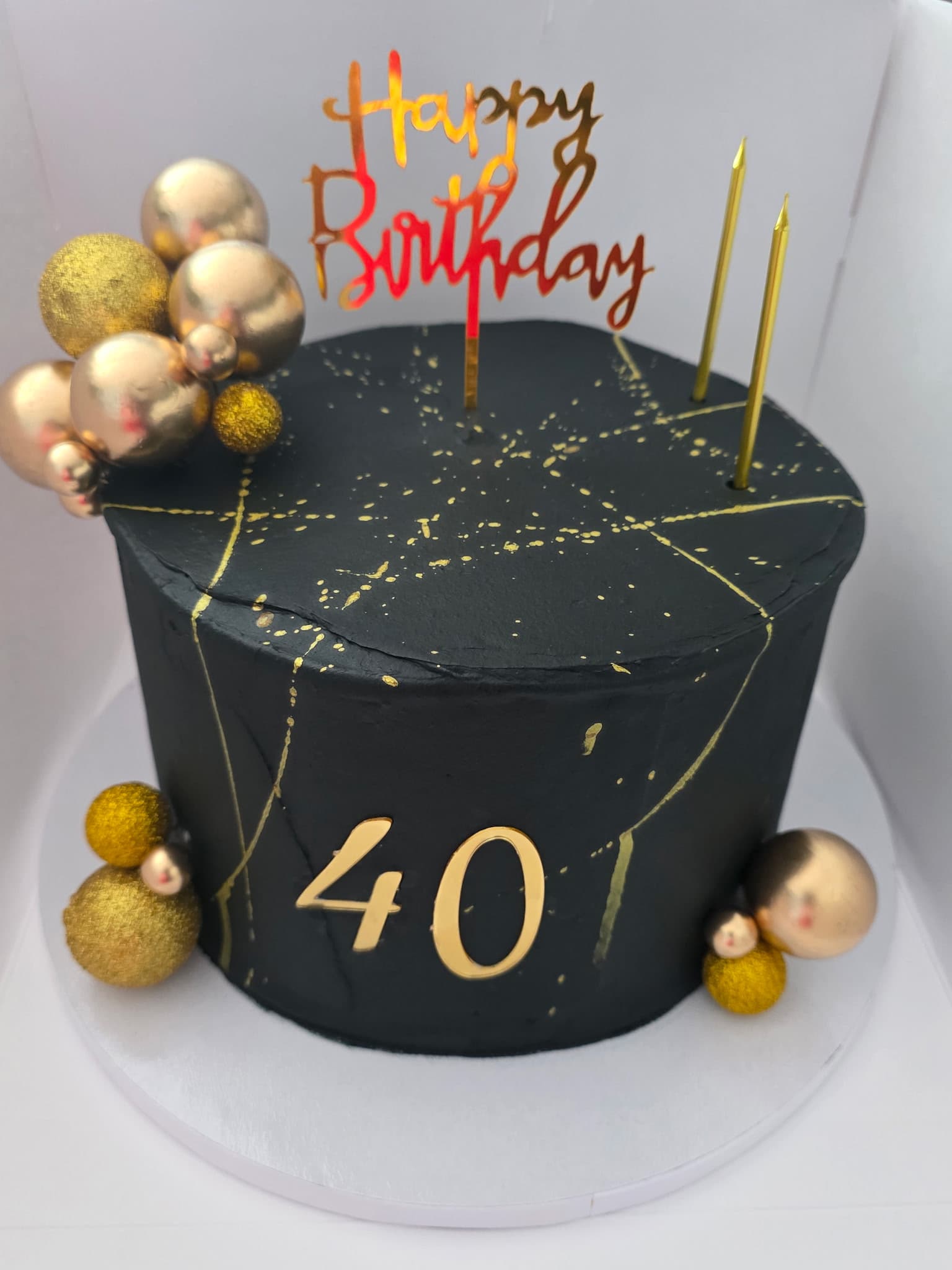 Black and gold custom birthday cake with gold balloon decorations by Cupcake City 813